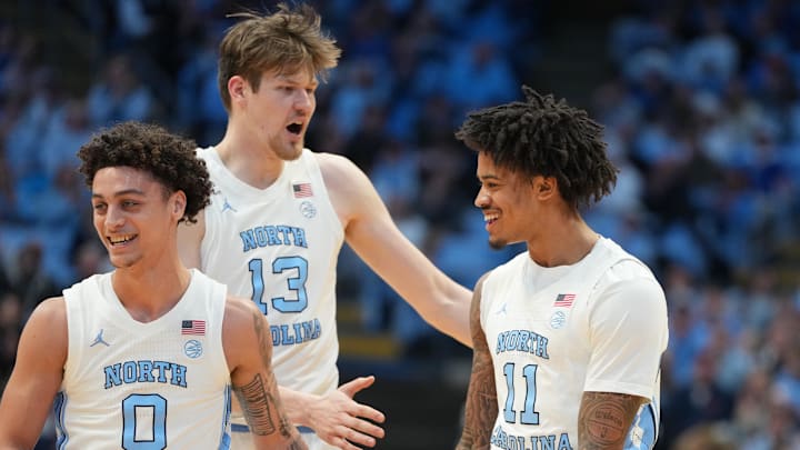 Feb 2, 2026; Chapel Hill, North Carolina, USA; North Carolina Tar Heels guard Kyan Evans (0) and center Henri Veesaar (13) and forward Jonathan Powell (11) react in the first half at Dean E. Smith Center. Mandatory Credit: Bob Donnan-Imagn Images Feb 2, 2026; Chapel Hill, North Carolina, USA; North Carolina Tar Heels guard Kyan Evans (0) and center Henri Veesaar (13) and forward Jonathan Powell (11) react in the first half at Dean E. Smith Center. Mandatory Credit: Bob Donnan-Imagn Images