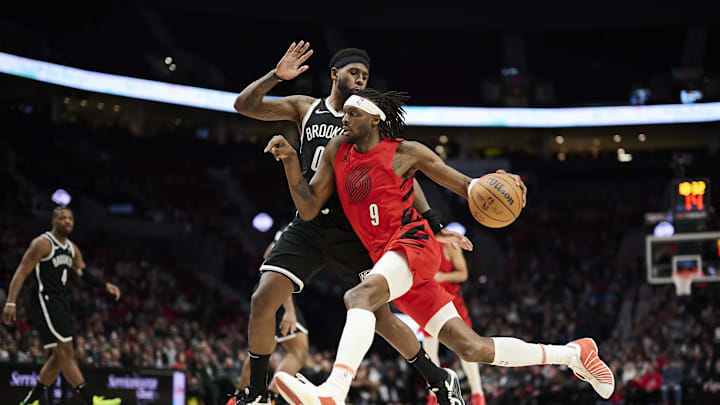 Jan 17, 2024; Portland, Oregon, USA; Portland Trail Blazers forward Jerami Grant (9) drives to the basket during the second half against Brooklyn Nets forward Royce O'Neale (00) at Moda Center. Mandatory Credit: Troy Wayrynen-Imagn Images