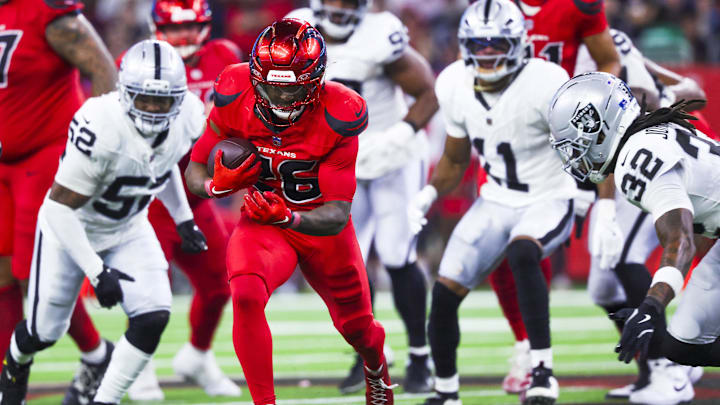 Dec 21, 2025; Houston, Texas, USA; Houston Texans running back Jawhar Jordan (26) rushes against the Las Vegas Raiders during the fourth quarter at NRG Stadium. Mandatory Credit: Troy Taormina-Imagn Images