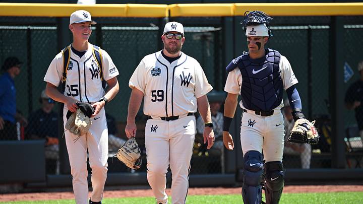Jun 12, 2026; Omaha, NE, USA;  West Virginia Mountaineers starting pitcher Chansen Cole (35) walks to the dugout with West Virginia Mountaineers catcher Matthew Graveline (0) before the game against the Troy Trojans at Charles Schwab Field. Mandatory Credit: Steven Branscombe-Imagn Images