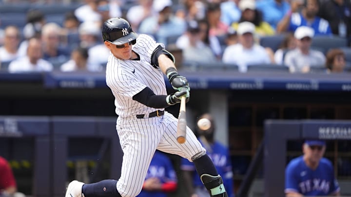 Jun 25, 2023; Bronx, New York, USA; New York Yankees center fielder Harrison Bader (22) hits a double against the Texas Rangers during the sixth inning at Yankee Stadium. Mandatory Credit: Gregory Fisher-Imagn Images