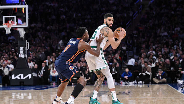 Apr 8, 2025; New York, New York, USA; Boston Celtics forward Jayson Tatum (0) sets the play while being defended by New York Knicks forward OG Anunoby (8) during the second half at Madison Square Garden. Mandatory Credit: John Jones-Imagn Images