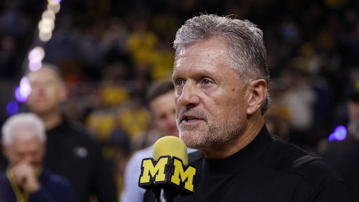 Jan 2, 2026; Ann Arbor, Michigan, USA;  Michigan Wolverines football head coach Kyle Whittingham speaks to the crowd during a time out in the first half against the Southern California Trojans at Crisler Center. Mandatory Credit: Rick Osentoski-Imagn Images