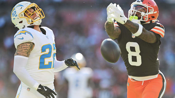 Nov 3, 2024; Cleveland, Ohio, USA; Cleveland Browns wide receiver Elijah Moore (8) and Los Angeles Chargers cornerback Elijah Molden (22) go for a pass during the second half at Huntington Bank Field. -
