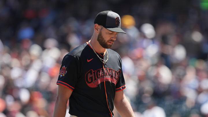 San Francisco, California, USA; San Francisco Giants starting pitcher Adrian Houser (12) walks to the dugout after being removed from the game against the Chicago White Sox during the fifth inning at Oracle Park. Mandatory Credit: Darren Yamashita-Imagn Images