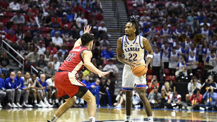 Mar 22, 2026; San Diego, CA, USA; Kansas Jayhawks guard Darryn Peterson (22) controls the ball against St. John's Red Storm guard Lefteris Liotopoulos (31) in the first half during a second round game of the men's 2026 NCAA Tournament at Viejas Arena. Mandatory Credit: Denis Poroy-Imagn Images