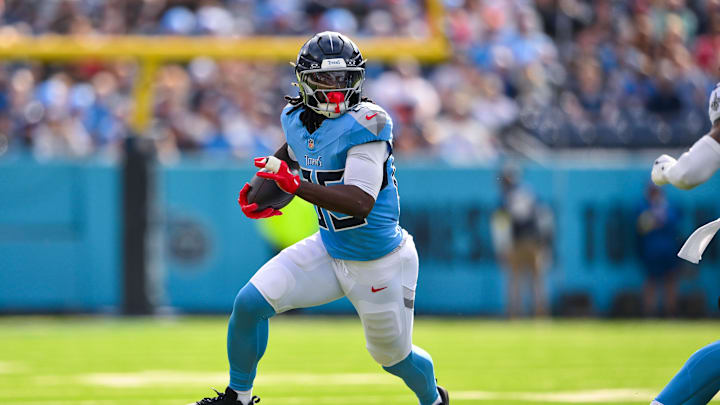 Dec 28, 2025; Nashville, Tennessee, USA;  Tennessee Titans tight end Chigoziem Okonkwo (85) runs with the ball after a made catch against the New Orleans Saints during the first half at Nissan Stadium. Mandatory Credit: Steve Roberts-Imagn Images