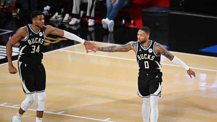 Dec 14, 2024; Las Vegas, Nevada, USA; Milwaukee Bucks guard Damian Lillard (0) and forward Giannis Antetokounmpo (34) react during the fourth quarter against the Atlanta Hawks in a semifinal of the 2024 Emirates NBA Cup at T-Mobile Arena. Mandatory Credit: Candice Ward-Imagn Images