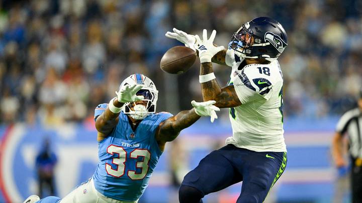 Aug 23, 2026; Nashville, Tennessee, USA;  Tennessee Titans linebacker Cedric Gray (33) breaks up the pass thrown to Seattle Seahawks tight end Elijah Arroyo (18) during the first half at Nissan Stadium.  Mandatory Credit: Steve Roberts-Imagn Images