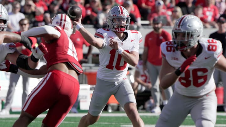Oct 18, 2025; Madison, Wisconsin, USA; Ohio State quarterback Julian Sayin (10) throws a pass during the during the first quarter of their game against Wisconsin at Camp Randall Stadium.