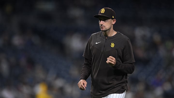 Jun 11, 2022; San Diego, California, USA; San Diego Padres acting manager Ryan Flaherty walks to the dugout after a pitching change during the ninth inning against the Colorado Rockies at Petco Park. Mandatory Credit: Orlando Ramirez-Imagn Images Jun 11, 2022; San Diego, California, USA; San Diego Padres acting manager Ryan Flaherty walks to the dugout after a pitching change during the ninth inning against the Colorado Rockies at Petco Park. Mandatory Credit: Orlando Ramirez-Imagn Images
