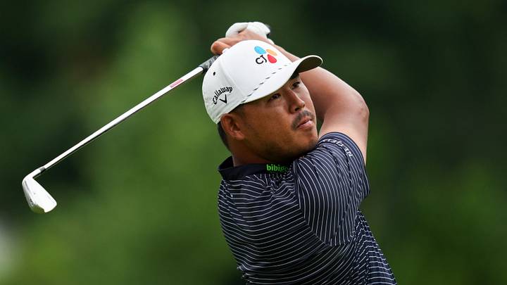 Aug 2, 2026; Detroit, Michigan, USA;  Si Woo Kim plays his shot from the ninth tee during the final round of the Rocket Classic golf tournament. Mandatory Credit: Aaron Doster-Imagn Images