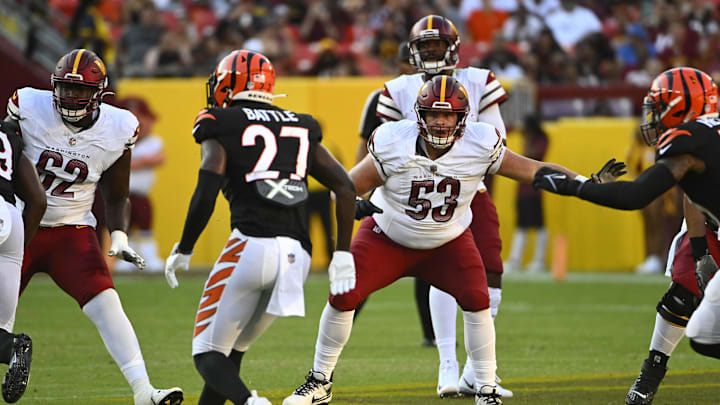 Aug 26, 2023; Landover, Maryland, USA; Washington Commanders center Ricky Stromberg (53) prepares to block against the Cincinnati Bengals during the first half at FedExField. Mandatory Credit: Brad Mills-USA TODAY Sports