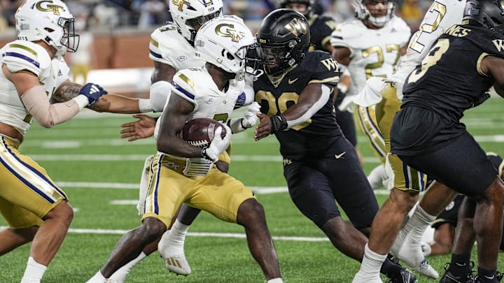 Sep 23, 2023; Winston-Salem, North Carolina, USA; Wake Forest Demon Deacons defensive back Jamare Glasker (25) tackles Georgia Tech Yellow Jackets wide receiver Christian Leary (6) during the second half at Allegacy Federal Credit Union Stadium. Mandatory Credit: Jim Dedmon-USA TODAY Sports Sep 23, 2023; Winston-Salem, North Carolina, USA; Wake Forest Demon Deacons defensive back Jamare Glasker (25) tackles Georgia Tech Yellow Jackets wide receiver Christian Leary (6) during the second half at Allegacy Federal Credit Union Stadium. Mandatory Credit: Jim Dedmon-USA TODAY Sports