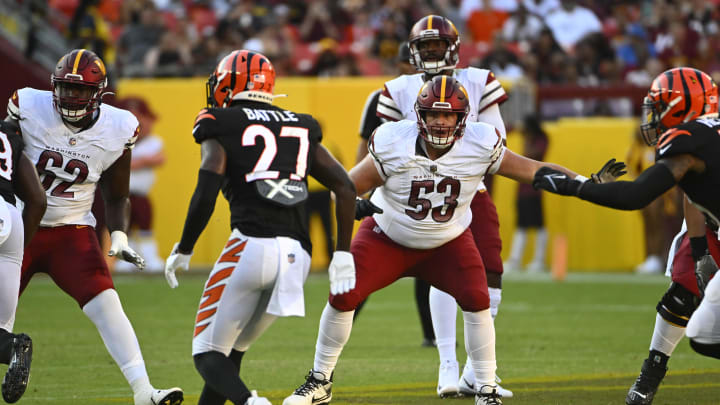 Aug 26, 2023; Landover, Maryland, USA; Washington Commanders center Ricky Stromberg (53) prepares to block against the Cincinnati Bengals during the first half at FedExField. Mandatory Credit: Brad Mills-USA TODAY Sports