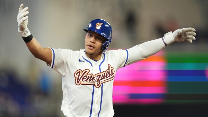 Mar 6, 2026; Miami, FL, United States;  Venezuela outfielder Javier Sanoja (4) celebrates his solo home run in the second inning against the Netherlands at loanDepot Park. Mandatory Credit: Jim Rassol-Imagn Images