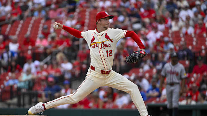 Jul 12, 2025; St. Louis, Missouri, USA;  St. Louis Cardinals starting pitcher Erick Fedde (12) pitches against the Atlanta Braves during the first inning at Busch Stadium. Mandatory Credit: Jeff Curry-Imagn Images