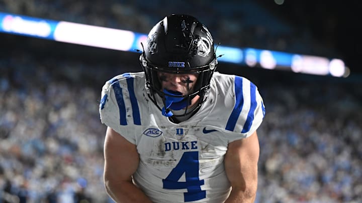 Nov 22, 2025; Chapel Hill, North Carolina, USA; Duke Blue Devils running back Anderson Castle (4) celebrates after a touchdown during the second half at Kenan Stadium. Mandatory Credit: William Howard-Imagn Images