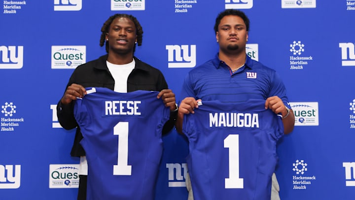 Apr 24, 2026; East Rutherford, NJ, USA; New York Giants draft picks Arvell Reese and Francis Mauigoa pose for a photo during the introductory press conference at Quest Diagnostics Training Center. 