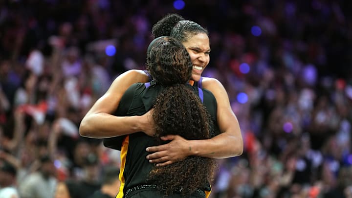 Sep 28, 2025; Phoenix, Arizona, USA; Phoenix Mercury guard Monique Akoa Makani (8) and forward Alyssa Thomas (25) celebrate after defeating the Minnesota Lynx during game four of the second round for the 2025 WNBA Playoffs at PHX Arena. Mandatory Credit: Rick Scuteri-Imagn Images