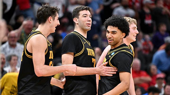 Mar 26, 2026; Houston, TX, USA; Iowa Hawkeyes forward Alvaro Folgueiras (7), guard Kael Combs (11) and guard Tate Sage (24) reacts against the Nebraska Cornhuskers during a Sweet Sixteen game of the South Regional of the men's 2026 NCAA Tournament at Toyota Center. Mandatory Credit: Maria Lysaker-Imagn Images Mar 26, 2026; Houston, TX, USA; Iowa Hawkeyes forward Alvaro Folgueiras (7), guard Kael Combs (11) and guard Tate Sage (24) reacts against the Nebraska Cornhuskers during a Sweet Sixteen game of the South Regional of the men's 2026 NCAA Tournament at Toyota Center. Mandatory Credit: Maria Lysaker-Imagn Images