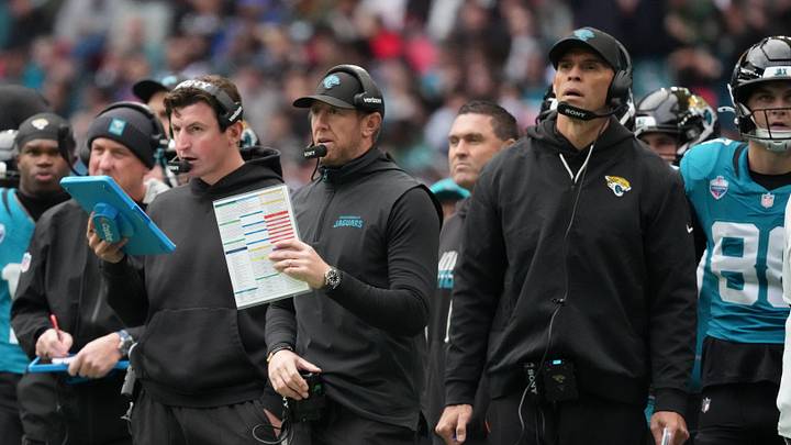 Oct 18, 2026; London, ENG; From left, Jacksonville Jaguars offensive coordinator Grant Udinski, head coach Liam Coen, and tight ends coach Richard Angulo look on during the first half against the Houston Texans at Wembley Stadium. Mandatory Credit: Kirby Lee-Imagn Images Oct 18, 2026; London, ENG; From left, Jacksonville Jaguars offensive coordinator Grant Udinski, head coach Liam Coen, and tight ends coach Richard Angulo look on during the first half against the Houston Texans at Wembley Stadium. Mandatory Credit: Kirby Lee-Imagn Images