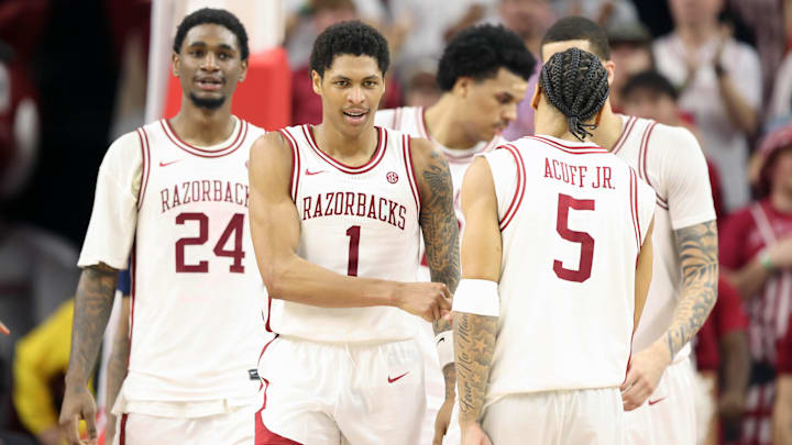 Feb 14, 2026; Fayetteville, Arkansas, USA; Arkansas Razorbacks guard Meleek Thomas (1) celebrates after a play during the second half against the Auburn Tigers at Bud Walton Arena. Mandatory Credit: Nelson Chenault-Imagn Images