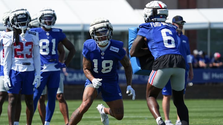 Jul 26, 2024; East Rutherford, NJ, USA; New York Giants wide receiver Isaiah Hodgins (18) does a drill during training camp at Quest Diagnostics Training Center. Mandatory Credit: Lucas Boland-USA TODAY Sports