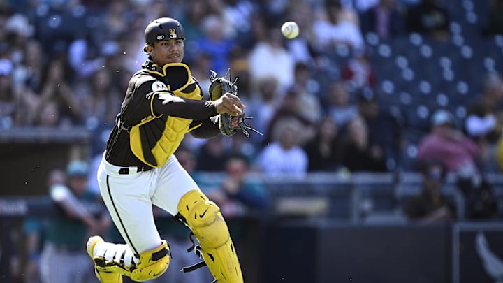 Mar 26, 2024; San Diego, California, USA; San Diego Padres catcher Ethan Salas (88) throws to first base during the ninth inning against the Seattle Mariners at Petco Park. Mandatory Credit: Orlando Ramirez-Imagn Images