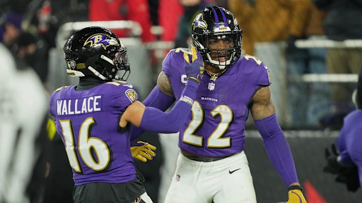 Jan 11, 2025; Baltimore, Maryland, USA; Baltimore Ravens running back Derrick Henry (22) celebrates with wide receiver Tylan Wallace (16) after scoring a touchdown against the Pittsburgh Steelers in the third quarter in an AFC wild card game at M&T Bank Stadium. Mandatory Credit: Mitch Stringer-Imagn Images