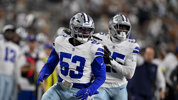 Aug 16, 2025; Arlington, Texas, USA; Dallas Cowboys linebacker James Houston (53) and cornerback Andrew Booth (25) return an interception for a touchdown during the game between the Dallas Cowboys and the Baltimore Ravens at AT&T Stadium. Mandatory Credit: Jerome Miron-Imagn Images