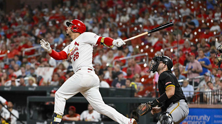 St. Louis Cardinals third baseman Nolan Arenado (28) hits a one run single against the Pittsburgh Pirates during the third inning at Busch Stadium on Sept 18.