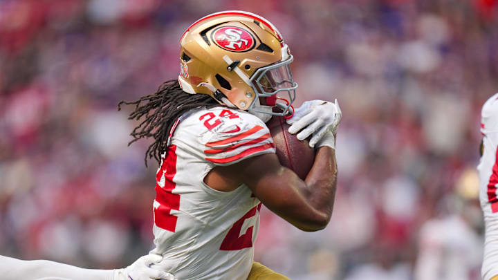 Sep 15, 2024; Minneapolis, Minnesota, USA; San Francisco 49ers running back Jordan Mason (24) scores a touchdown against the Minnesota Vikings in the fourth quarter at U.S. Bank Stadium. Mandatory Credit: Brad Rempel-Imagn Images