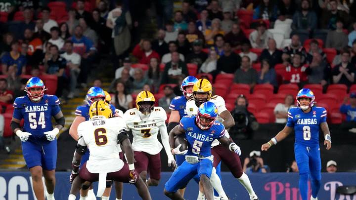 Sep 19, 2026; London, ENG; Kansas Jayhawks wide receiver Nik McMillan (5) runs with the ball against the Arizona State Sun Devils during the second half at Wembley Stadium. Mandatory Credit: Peter van den Berg-Imagn Images Sep 19, 2026; London, ENG; Kansas Jayhawks wide receiver Nik McMillan (5) runs with the ball against the Arizona State Sun Devils during the second half at Wembley Stadium. Mandatory Credit: Peter van den Berg-Imagn Images