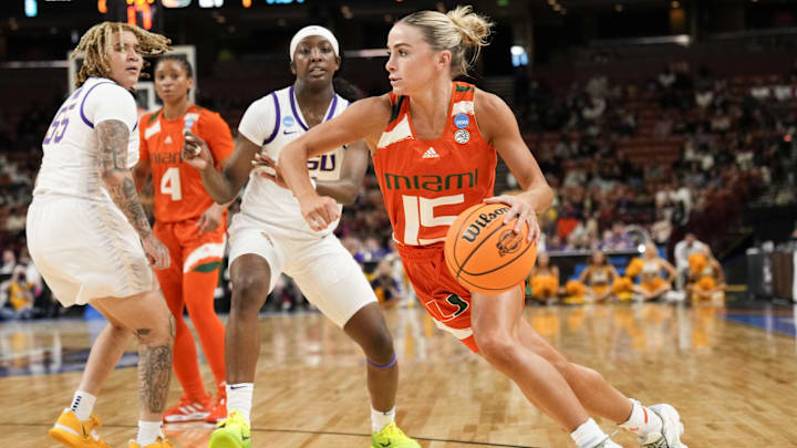 Mar 26, 2023; Greenville, SC, USA; Miami Hurricanes guard Hanna Cavinder (15) drives to the basket against the LSU Lady Tigers during the second half of the NCAA Women   s Tournament at Bon Secours Wellness Arena. Mandatory Credit: Jim Dedmon-Imagn Images