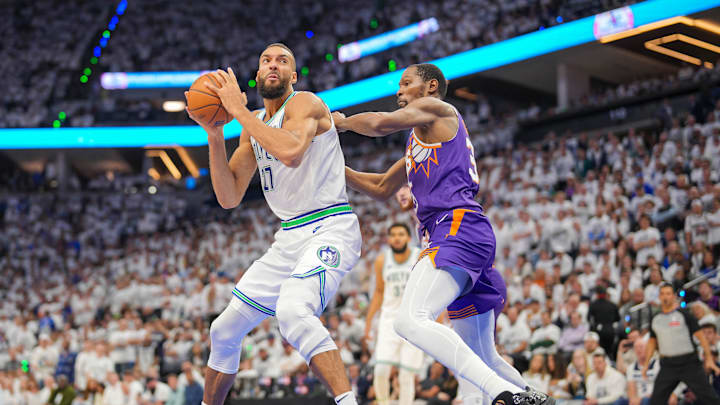 Apr 23, 2024; Minneapolis, Minnesota, USA; Phoenix Suns forward Kevin Durant (35) defends against Minnesota Timberwolves center Rudy Gobert (27) in the fourth quarter during game two of the first round for the 2024 NBA playoffs at Target Center. Mandatory Credit: Brad Rempel-Imagn Images Apr 23, 2024; Minneapolis, Minnesota, USA; Phoenix Suns forward Kevin Durant (35) defends against Minnesota Timberwolves center Rudy Gobert (27) in the fourth quarter during game two of the first round for the 2024 NBA playoffs at Target Center. Mandatory Credit: Brad Rempel-Imagn Images