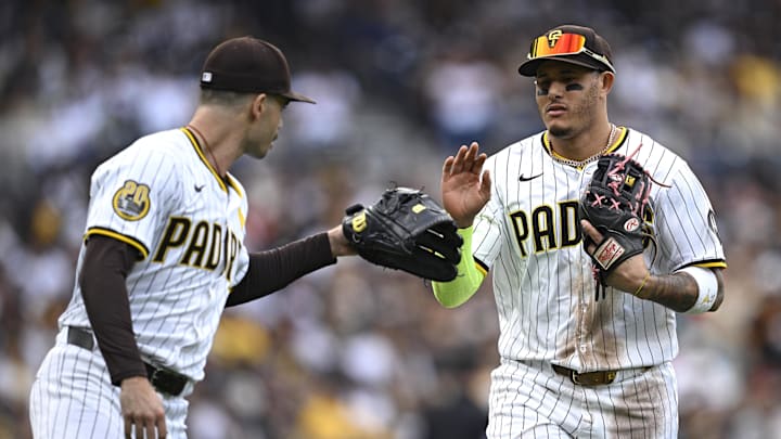Sep 18, 2024; San Diego, California, USA; San Diego Padres third baseman Manny Machado (right) is greeted by starting pitcher Dylan Cease (left) after a defensive play against the Houston Astros during the third inning at Petco Park. Mandatory Credit: Orlando Ramirez-Imagn Images Sep 18, 2024; San Diego, California, USA; San Diego Padres third baseman Manny Machado (right) is greeted by starting pitcher Dylan Cease (left) after a defensive play against the Houston Astros during the third inning at Petco Park. Mandatory Credit: Orlando Ramirez-Imagn Images