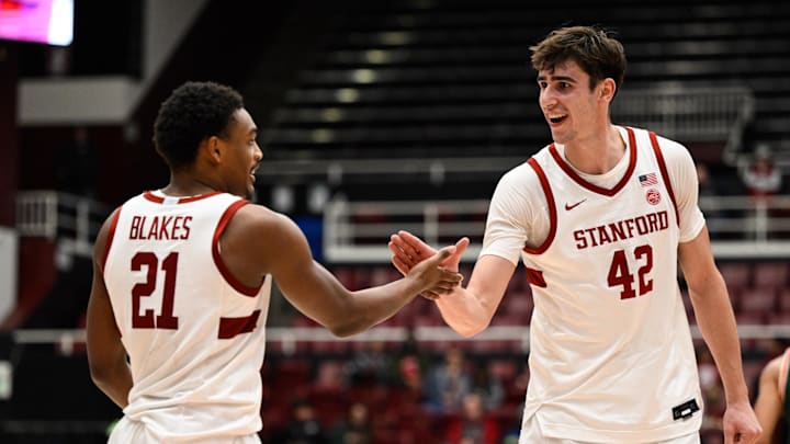 Jan 22, 2025; Stanford, California, USA; Stanford Cardinal forward Maxime Raynaud (42) and guard Jaylen Blakes (21) celebrate against the Miami (FL) Hurricanes in the second half at Maples Pavilion. Mandatory Credit: Eakin Howard-Imagn Images