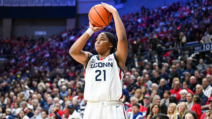 Nov 20, 2024; Storrs, Connecticut, USA; Connecticut Huskies forward Sarah Strong (21) shoots a three point basket during the second half against the Fairleigh Dickinson Knights at Harry A. Gampel Pavilion. Mandatory Credit: Mark Smith-Imagn Images