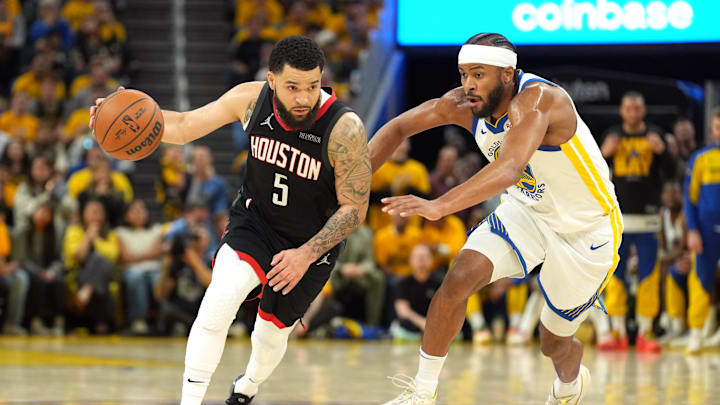 Houston Rockets guard Fred VanVleet dribbles against Golden State Warriors guard Moses Moody.