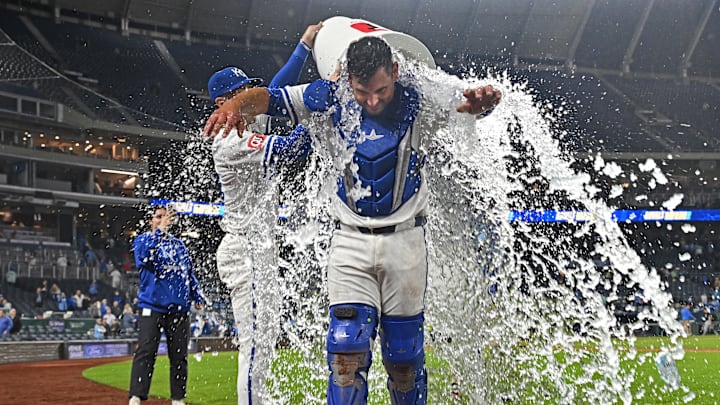 May 7, 2025; Kansas City, Missouri, USA;  Kansas City Royals catcher Luke Maile (15) reacts after getting doused with ice water from teammates center fielder Kyle Isbel (28) and right fielder Cavan Biggio (18) after beating the Chicago White Sox at Kauffman Stadium. Mandatory Credit: Peter Aiken-Imagn Images