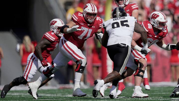 Wisconsin offensive lineman Riley Mahlman (71) an offensive lineman Joe Huber (60) block during the second quarter of their game Saturday, October 5, 2024 at Camp Randall Stadium in Madison, Wisconsin.