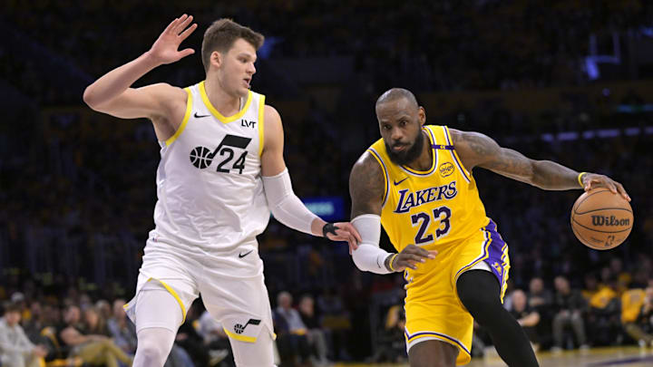 Feb 10, 2025; Los Angeles, California, USA; Los Angeles Lakers forward LeBron James (23) Utah Jazz center Walker Kessler (24) in the first half at Crypto.com Arena. 
