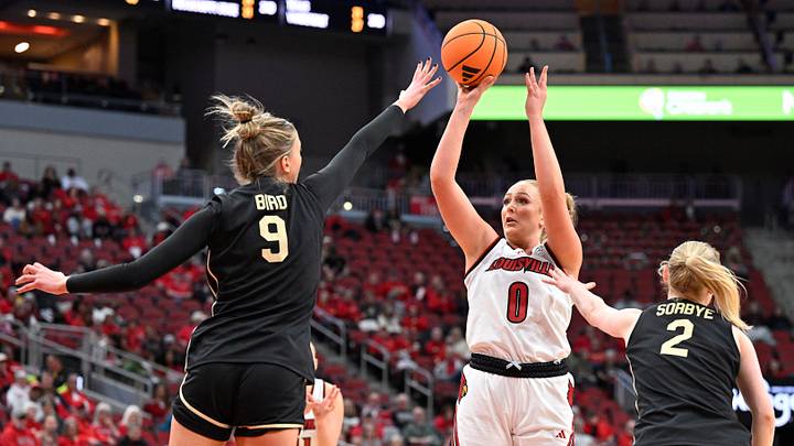 Feb 12, 2026; Louisville, Kentucky, USA; Louisville Cardinals forward Laura Ziegler (0) shoots against Wake Forest Demon Deacons forward Opal Bird (9) and guard Aurora Sørbye (2) during the second half at KFC Yum! Center. Louisville defeated Wake Forest 86-67. Mandatory Credit: Jamie Rhodes-Imagn Images Feb 12, 2026; Louisville, Kentucky, USA; Louisville Cardinals forward Laura Ziegler (0) shoots against Wake Forest Demon Deacons forward Opal Bird (9) and guard Aurora Sørbye (2) during the second half at KFC Yum! Center. Louisville defeated Wake Forest 86-67. Mandatory Credit: Jamie Rhodes-Imagn Images