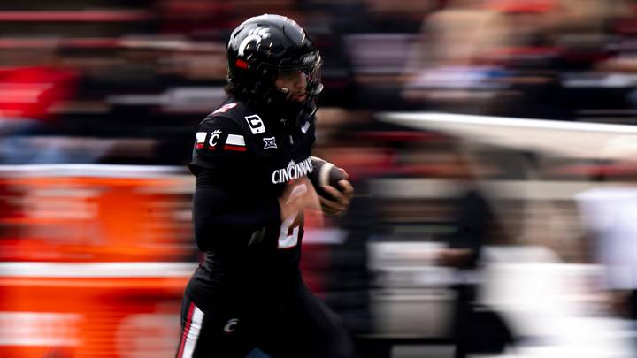 Cincinnati Bearcats quarterback Brendan Sorsby (2) runs with the ball during warm ups before the NCAA football game between the Cincinnati Bearcats and Arizona Wildcats at Nippert Stadium in Cincinnati on Nov. 15, 2025.