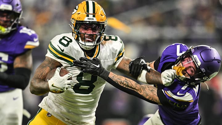 Green Bay Packers running back Josh Jacobs (8) avoids Minnesota Vikings cornerback Byron Murphy Jr. (7) during the fourth quarter at U.S. Bank Stadium. 