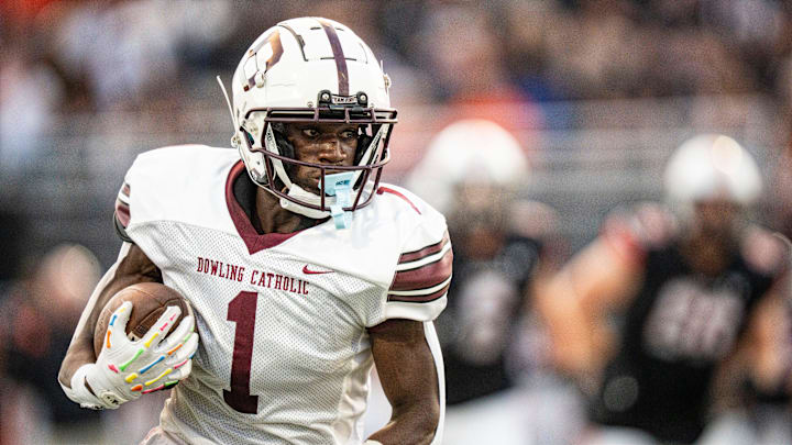 Dowling Catholic wide receiver Sam Drexler (1) carries the ball during a high school football game between Valley and Dowling Catholic on Aug. 29, 2025, at Valley Stadium in West Des Moines, Iowa. Valley defeated Dowling Catholic 20-19.