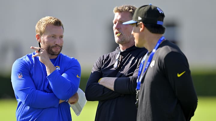 Jul 29, 2024; Los Angeles, CA, USA; Los Angeles Rams head coach Sean McVay, general manager Les Snead, and chief of staff Carter Crutchfield talk on the field during training camp at Loyola Marymount University. Mandatory Credit: Jayne Kamin-Oncea-Imagn Images