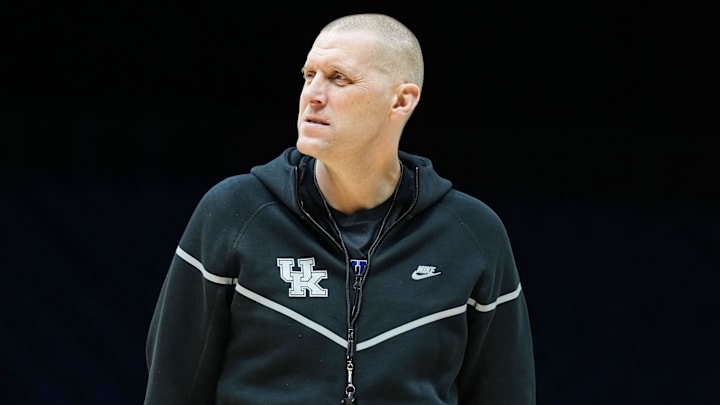 Kentucky Wildcats head coach Mark Pope walks onto the court Thursday, March 27, 2025, during practice ahead of the Sweet 16 March Madness tournament game against the Tennessee Volunteers at Lucas Oil Stadium in Indianapolis.