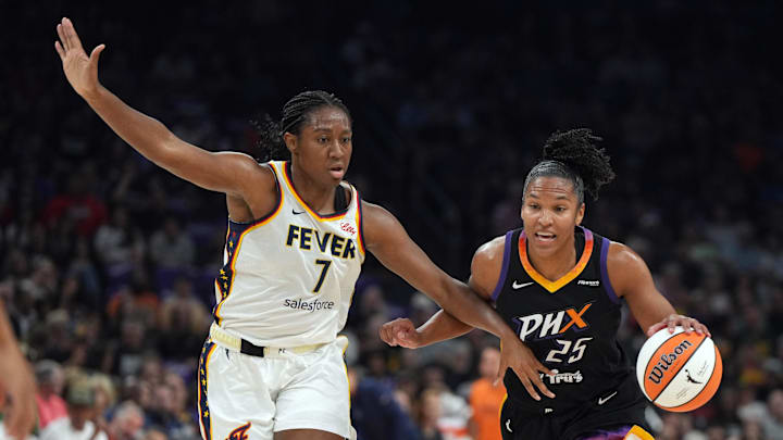 Sep 2, 2025; Phoenix, Arizona, USA; Phoenix Mercury forward Alyssa Thomas (25) drives on Indiana Fever forward Aliyah Boston (7) in the first half at PHX Arena. Mandatory Credit: Rick Scuteri-Imagn Images